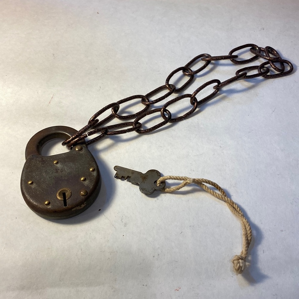 Antique lock on chain with key